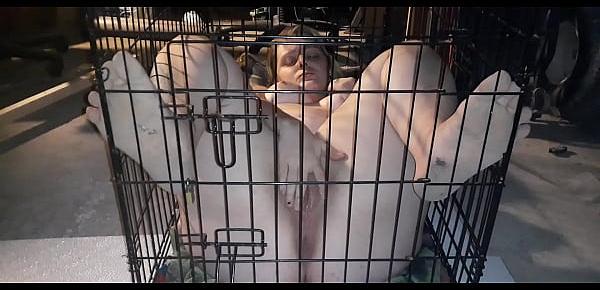  My sex slave plays with herself while locked inside cage